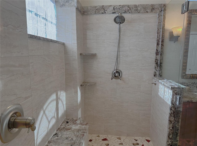 bathroom featuring a shower stall