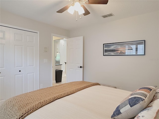 bedroom featuring a closet, a ceiling fan, and visible vents