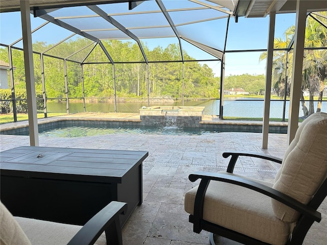view of patio / terrace featuring a water view, an in ground hot tub, glass enclosure, and an outdoor pool