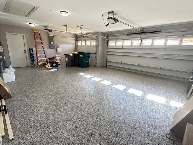 garage featuring electric panel and a garage door opener