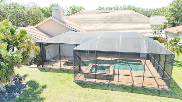 rear view of house with a patio area, an outdoor pool, a tiled roof, and a lanai