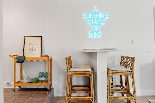 2215 Thrace St, Tampa, FL 33605 - tiled dining space featuring baseboards