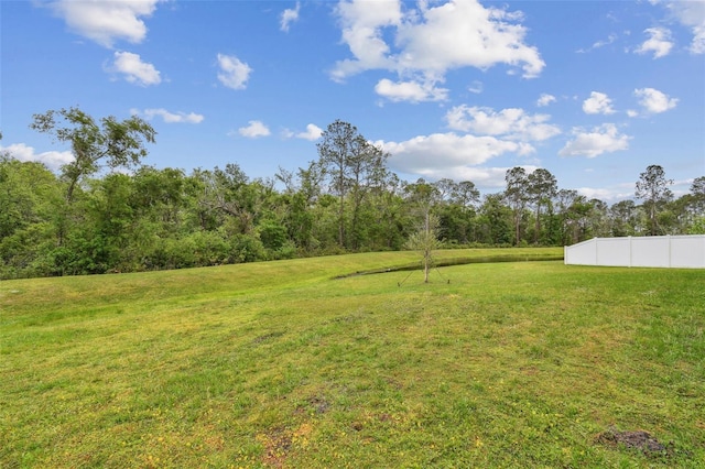 view of yard with fence