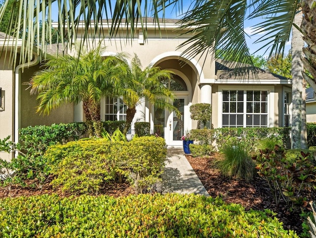 property entrance featuring stucco siding