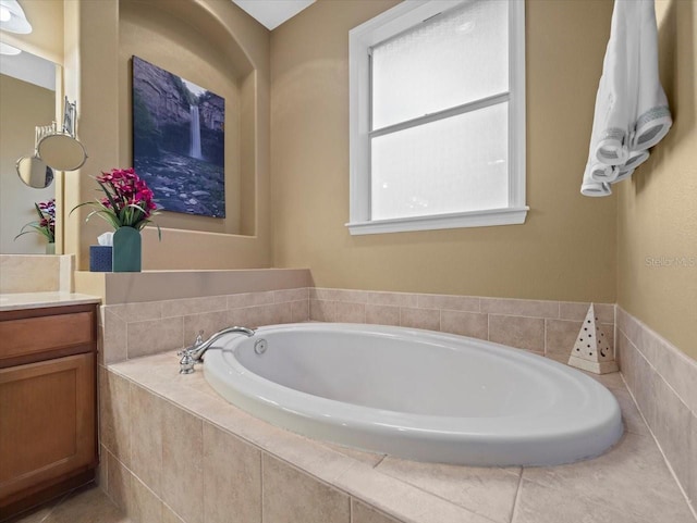 full bath with a garden tub and vanity