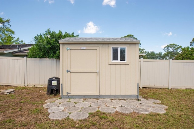 view of shed featuring a fenced backyard