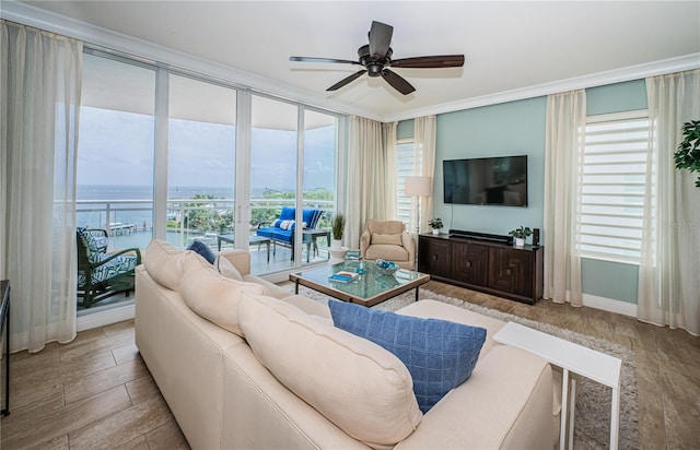 1325 Snell Isle Blvd NE Unit 607, Saint Petersburg, FL 33704 - living room with a water view, ceiling fan, floor to ceiling windows, wood finished floors, and ornamental molding