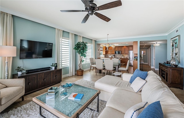1325 Snell Isle Blvd NE Unit 607, Saint Petersburg, FL 33704 - living area featuring crown molding, baseboards, ceiling fan, a chandelier, and light wood-type flooring