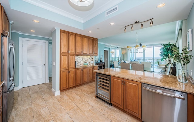 1325 Snell Isle Blvd NE Unit 607, Saint Petersburg, FL 33704 - kitchen featuring stainless steel appliances, wine cooler, crown molding, brown cabinets, and light stone counters