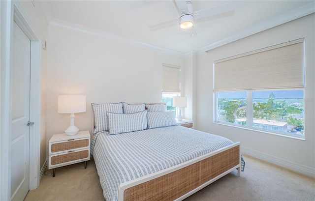1325 Snell Isle Blvd NE Unit 607, Saint Petersburg, FL 33704 - bedroom with light colored carpet, baseboards, ornamental molding, and a ceiling fan