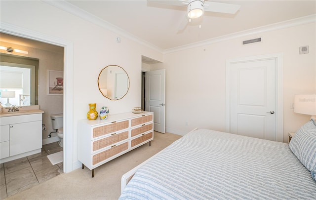 1325 Snell Isle Blvd NE Unit 607, Saint Petersburg, FL 33704 - bedroom with crown molding, a sink, baseboards, ensuite bathroom, and light colored carpet