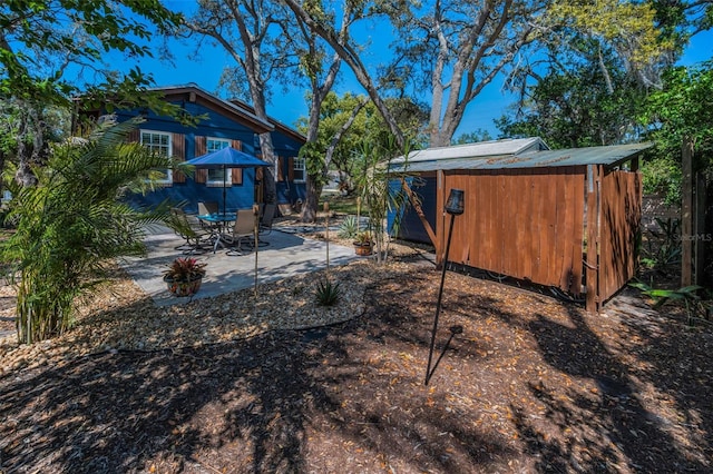 525 Lexington St, Dunedin, FL 34698 - view of yard with a patio and an outdoor structure