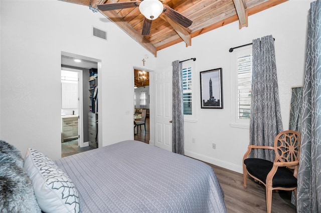 525 Lexington St, Dunedin, FL 34698 - bedroom with wooden ceiling, wood finished floors, baseboards, and ensuite bath