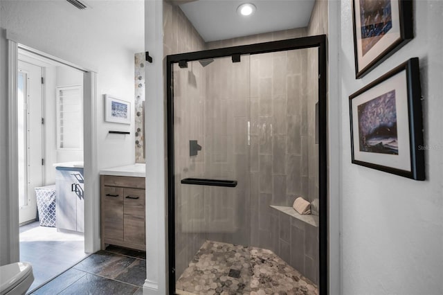 525 Lexington St, Dunedin, FL 34698 - full bath featuring a shower stall, toilet, and vanity