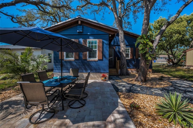525 Lexington St, Dunedin, FL 34698 - view of patio with outdoor dining area