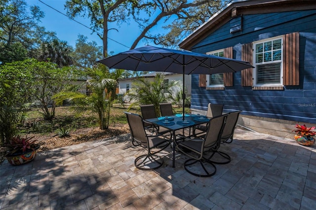 525 Lexington St, Dunedin, FL 34698 - view of patio featuring outdoor dining area