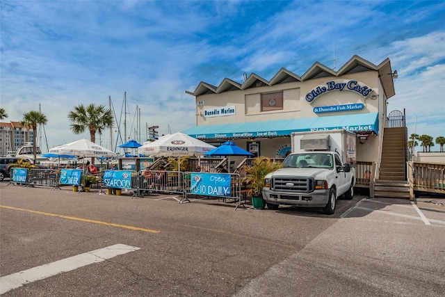 525 Lexington St, Dunedin, FL 34698 - view of commercial property with uncovered parking