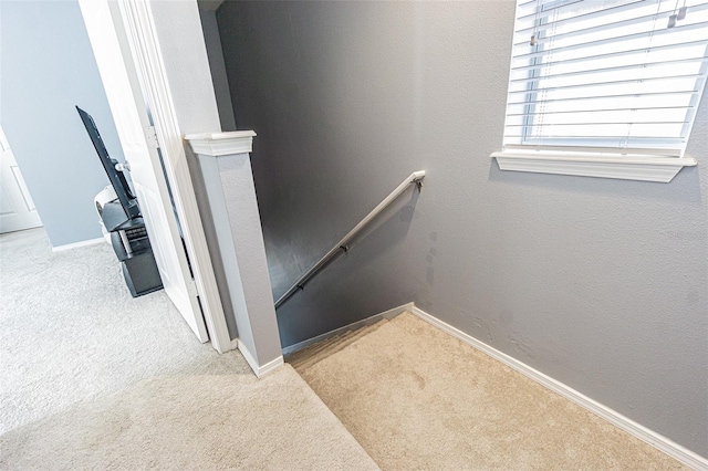stairway with carpet flooring and baseboards