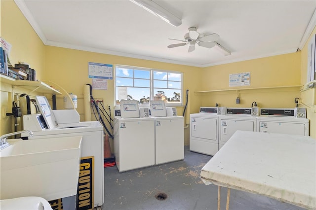 community laundry room with ornamental molding, washing machine and dryer, and ceiling fan