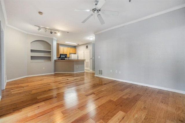 10103 Courtney Oaks Cir Unit 103, Tampa, FL 33619 - unfurnished living room featuring a ceiling fan, crown molding, light wood-style floors, visible vents, and built in shelves