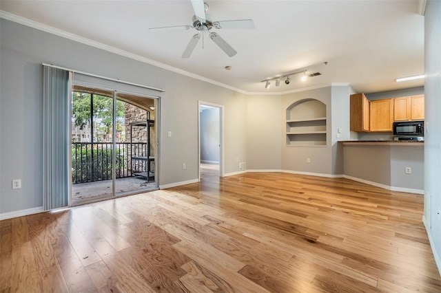 10103 Courtney Oaks Cir Unit 103, Tampa, FL 33619 - unfurnished living room featuring baseboards, built in features, ornamental molding, a ceiling fan, and light wood-style floors
