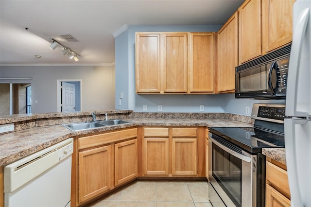 10103 Courtney Oaks Cir Unit 103, Tampa, FL 33619 - kitchen with a sink, ornamental molding, white appliances, rail lighting, and light tile patterned flooring