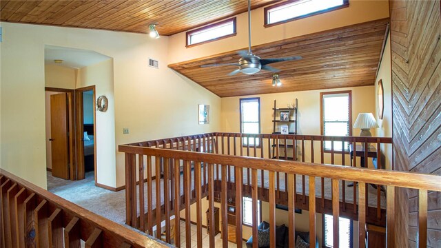 1691 Ridge Top Dr, Tarpon Springs, FL 34688 - hallway featuring baseboards, an upstairs landing, carpet floors, visible vents, and wood ceiling