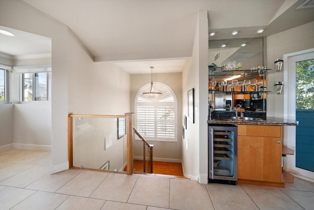 118 94th Ave, Treasure Island, FL 33706 - bar with baseboards, a sink, wet bar, and wine cooler