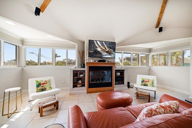 118 94th Ave, Treasure Island, FL 33706 - living room featuring baseboards, lofted ceiling with beams, ornamental molding, light tile patterned flooring, and a glass covered fireplace
