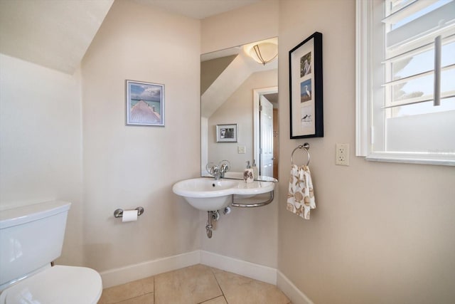 118 94th Ave, Treasure Island, FL 33706 - bathroom with a sink, tile patterned floors, toilet, and baseboards