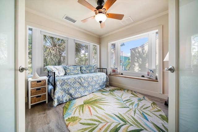 118 94th Ave, Treasure Island, FL 33706 - bedroom featuring wood finished floors, ornamental molding, and visible vents