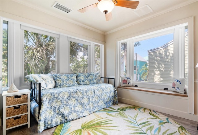 118 94th Ave, Treasure Island, FL 33706 - bedroom featuring wood finished floors, multiple windows, and visible vents