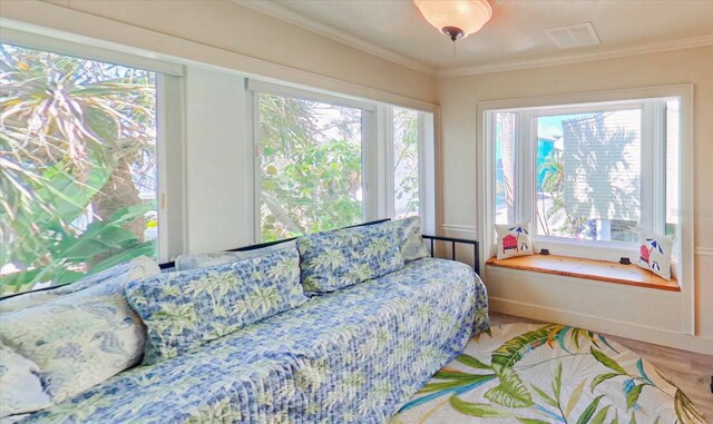 118 94th Ave, Treasure Island, FL 33706 - bedroom featuring visible vents, ornamental molding, and wood finished floors