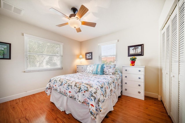 118 94th Ave, Treasure Island, FL 33706 - bedroom featuring visible vents, baseboards, a closet, and wood finished floors