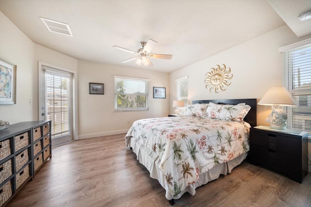 118 94th Ave, Treasure Island, FL 33706 - bedroom featuring visible vents, multiple windows, and wood finished floors