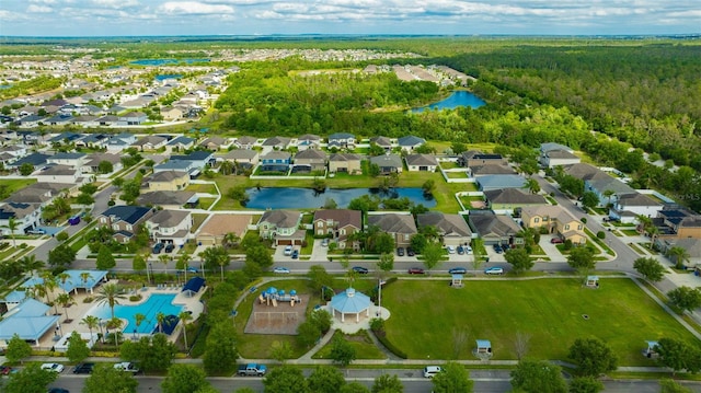 aerial view with a residential view, a water view, and a wooded view