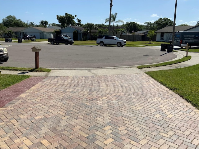 819 Satinleaf Ave, Oldsmar, FL 34677 - view of asphalt road with a residential view and sidewalks