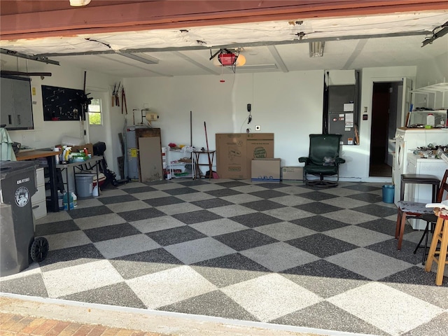 819 Satinleaf Ave, Oldsmar, FL 34677 - garage with a garage door opener, heating unit, electric water heater, and electric panel