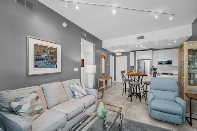400 4th Ave S Unit 401, Saint Petersburg, FL 33701 - living room featuring visible vents and track lighting