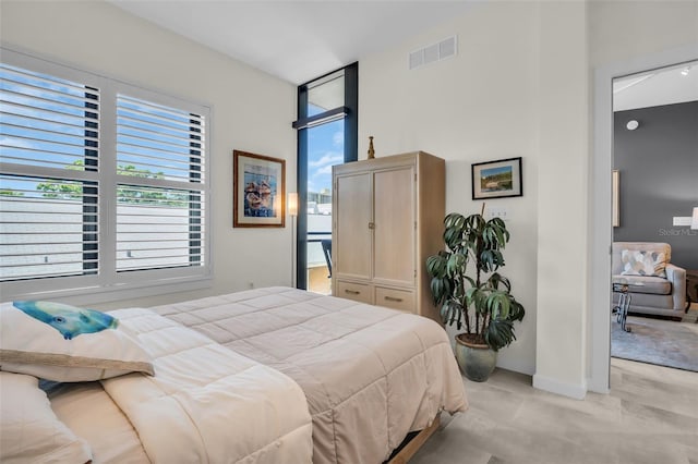400 4th Ave S Unit 401, Saint Petersburg, FL 33701 - bedroom featuring visible vents, baseboards, and light carpet