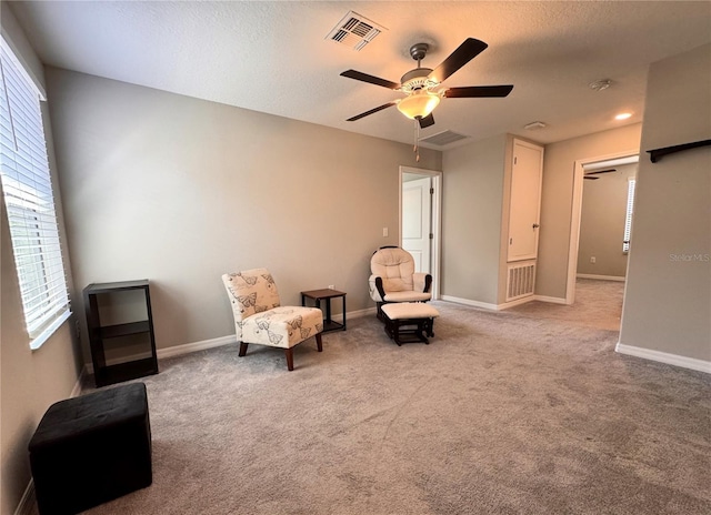 12717 Lemon Pepper Dr, Riverview, FL 33578 - living area featuring a ceiling fan, carpet flooring, and a textured ceiling