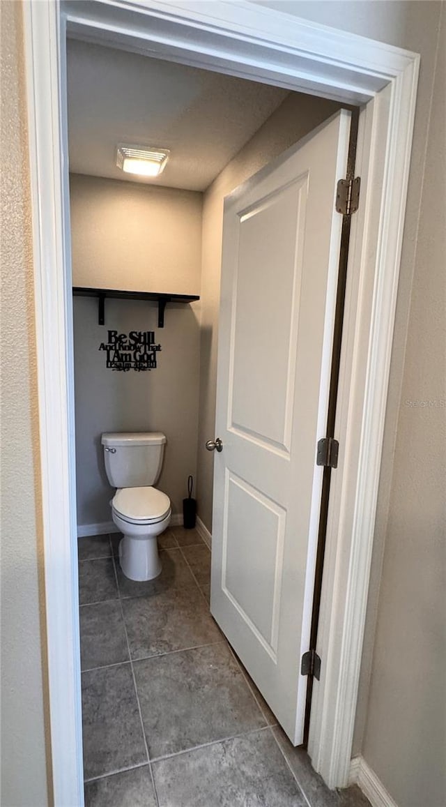 12717 Lemon Pepper Dr, Riverview, FL 33578 - bathroom featuring toilet and tile patterned flooring