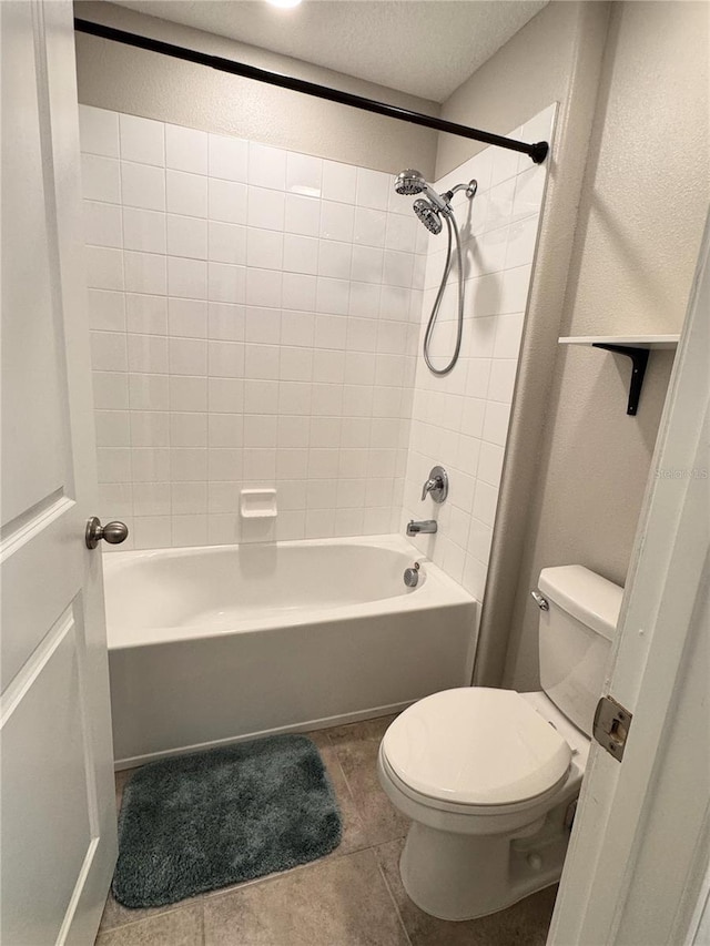 12717 Lemon Pepper Dr, Riverview, FL 33578 - full bathroom featuring washtub / shower combination, tile patterned flooring, and a textured ceiling