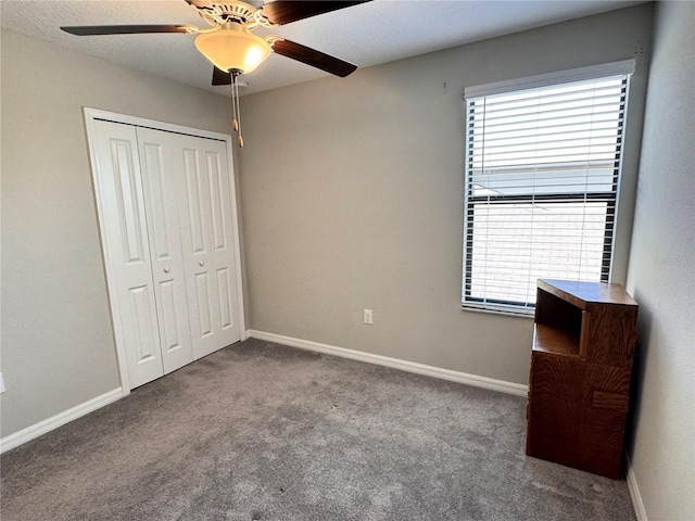 12717 Lemon Pepper Dr, Riverview, FL 33578 - unfurnished bedroom with carpet, multiple windows, a closet, and ceiling fan