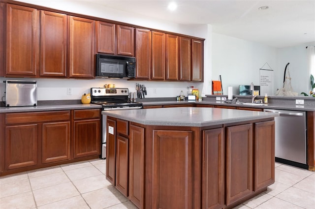 1105 Venetian Harbor Dr NE, Saint Petersburg, FL 33702 - kitchen with appliances with stainless steel finishes, light tile patterned floors, a center island, recessed lighting, and brown cabinetry