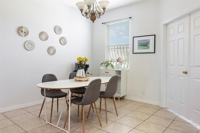 1105 Venetian Harbor Dr NE, Saint Petersburg, FL 33702 - dining room featuring a chandelier, light tile patterned floors, and baseboards