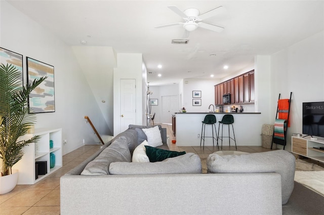 1105 Venetian Harbor Dr NE, Saint Petersburg, FL 33702 - living room featuring light tile patterned floors, ceiling fan, and recessed lighting