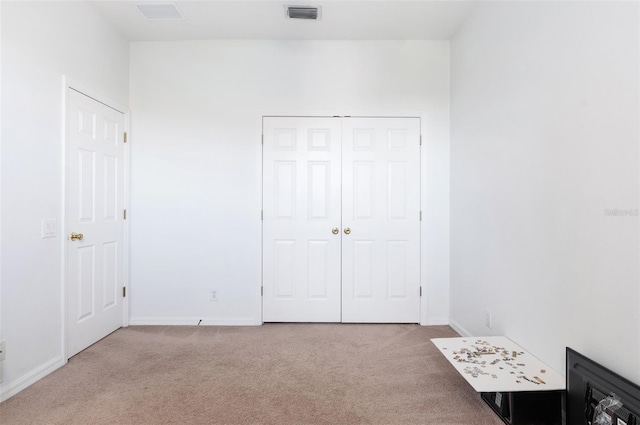 1105 Venetian Harbor Dr NE, Saint Petersburg, FL 33702 - unfurnished bedroom featuring carpet floors, baseboards, and a closet