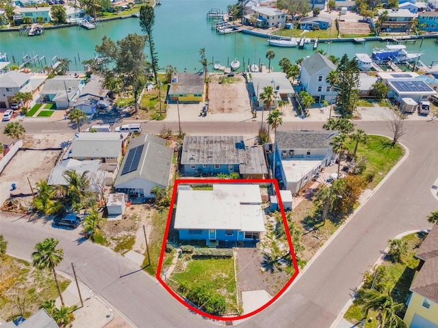 aerial view with a residential view and a water view