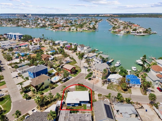 birds eye view of property with a residential view and a water view